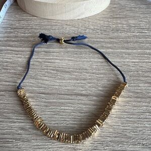 Gold Beaded Bracelet with Blue Cord